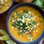 A delicious bowl of Mexican Street Corn Soup topped with cotija cheese, fresh cilantro, corn kernels, and a sprinkle of chili.