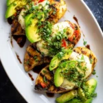 Grilled {{ $('Fetch Recipe Data').first().json["Main Keyword"] }} topped with melted mozzarella, fresh avocado, and balsamic.