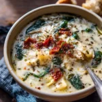 A warm bowl of {{ $('Fetch Recipe Data').first().json["Main Keyword"] }} topped with cheese and herbs.